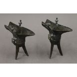A pair of Chinese bronze jues. 14 cm high.