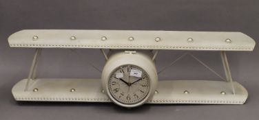 A clock modelled as a bi-plane. 90 cm wide.