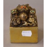 A Chinese gilt bronze dragon seal. 8.5 cm high.