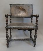 A 19th century leather covered Armada chair. 61.5 cm wide.