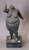 An abstract patinated bronze of a large lady. 45.5 cm high.