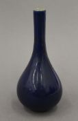 A small Chinese blue straight neck vase. 14.5 cm high.