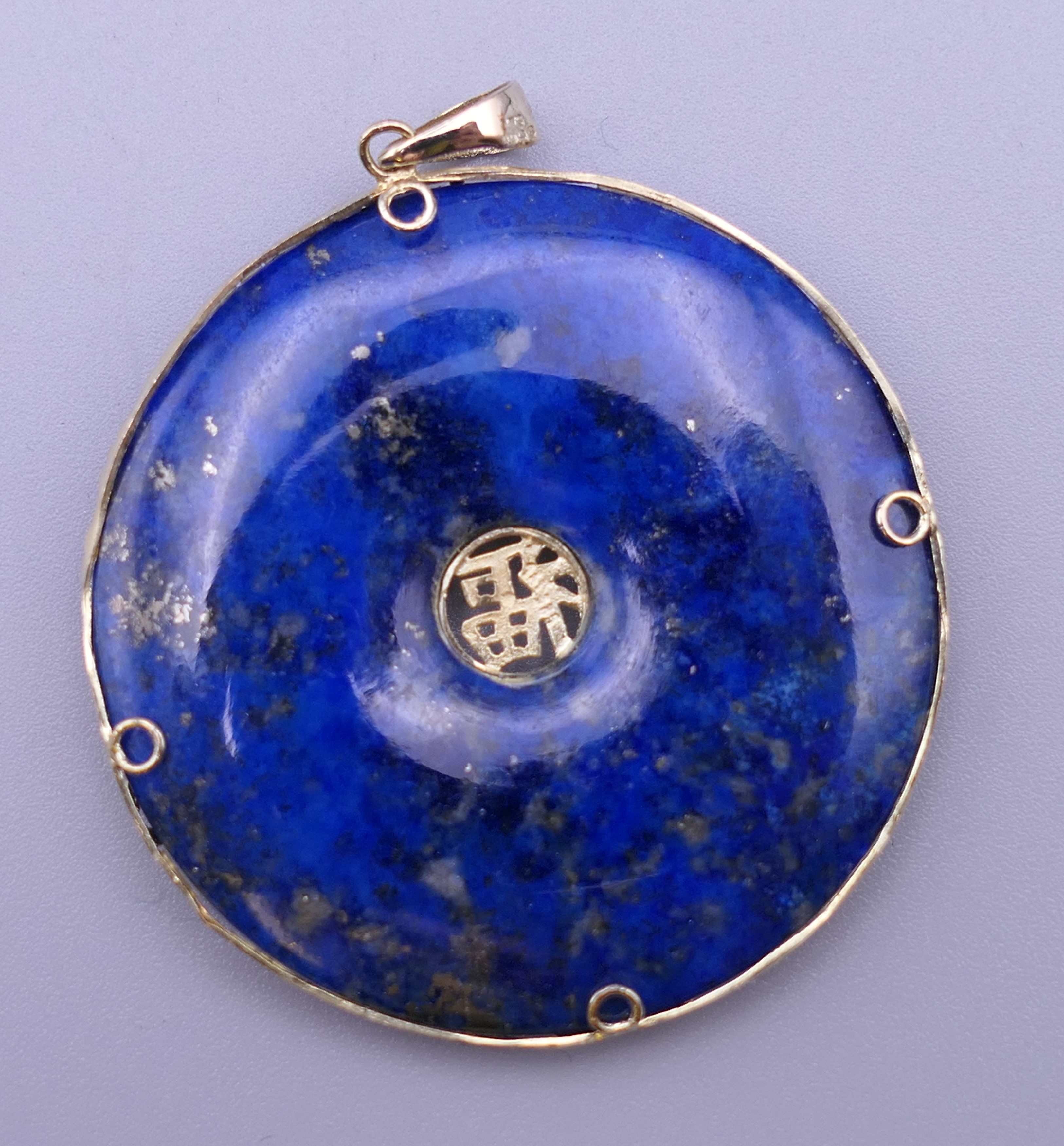 A Chinese 14 ct gold mounted lapis pendant. 3.5 cm diameter. - Image 2 of 3