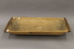 A 19th century dough trug. 79 cm long.