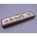 A bone and wooden box, the lid decorated with cranes. 15.5 cm long.