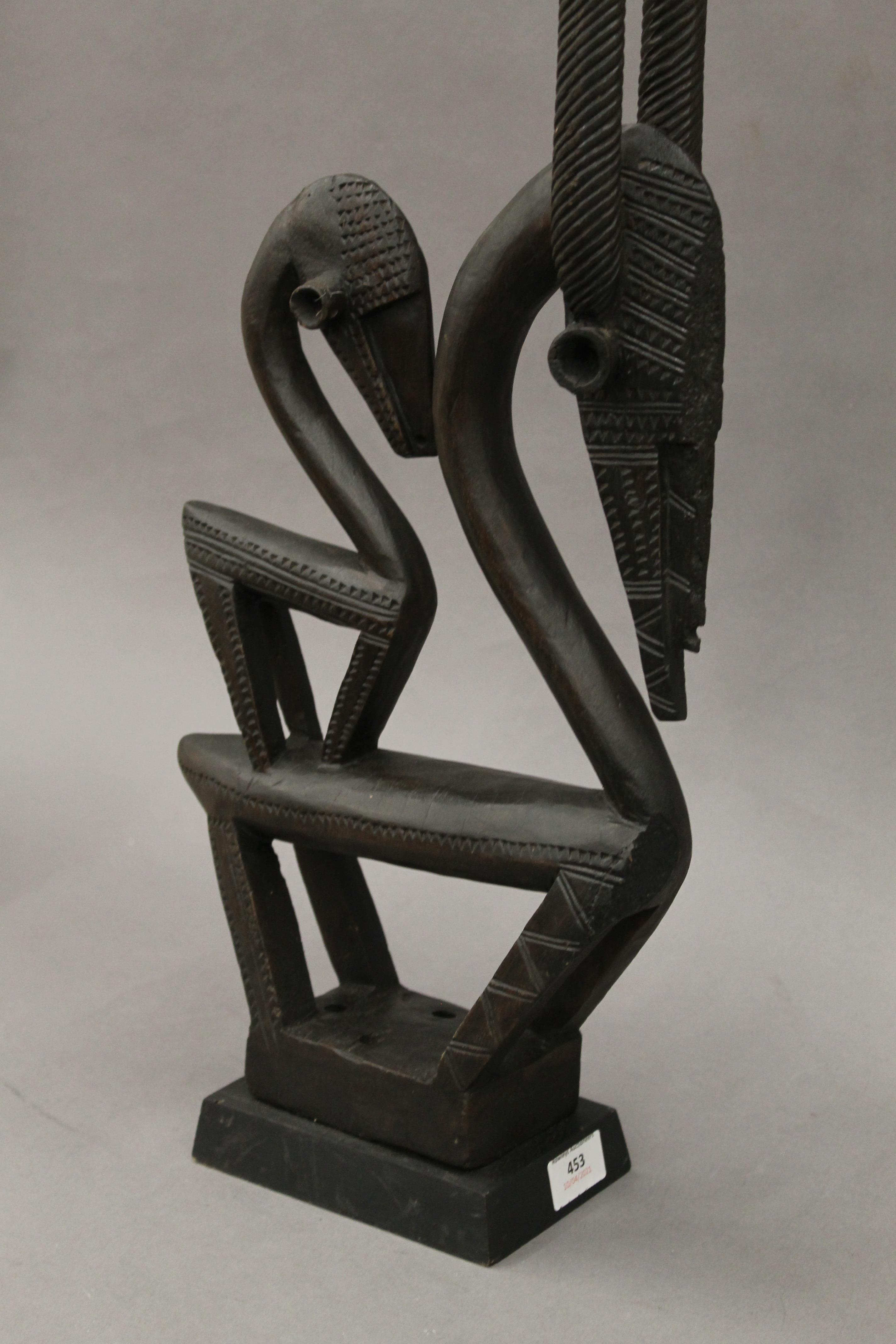 A Chiware double antelope headdress mounted on a plinth base. 81 cm high. - Image 2 of 3