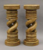 A pair of carved wooden columns. Each 69 cm high.