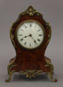 A 19th century French burr walnut mantle clock. 25 cm high.