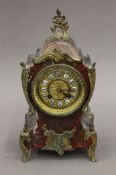 A 19th century Boulle mantle clock. 30 cm high.