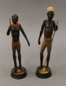 A pair of ethnographical carved wooden figures. The largest 26.5 cm high.