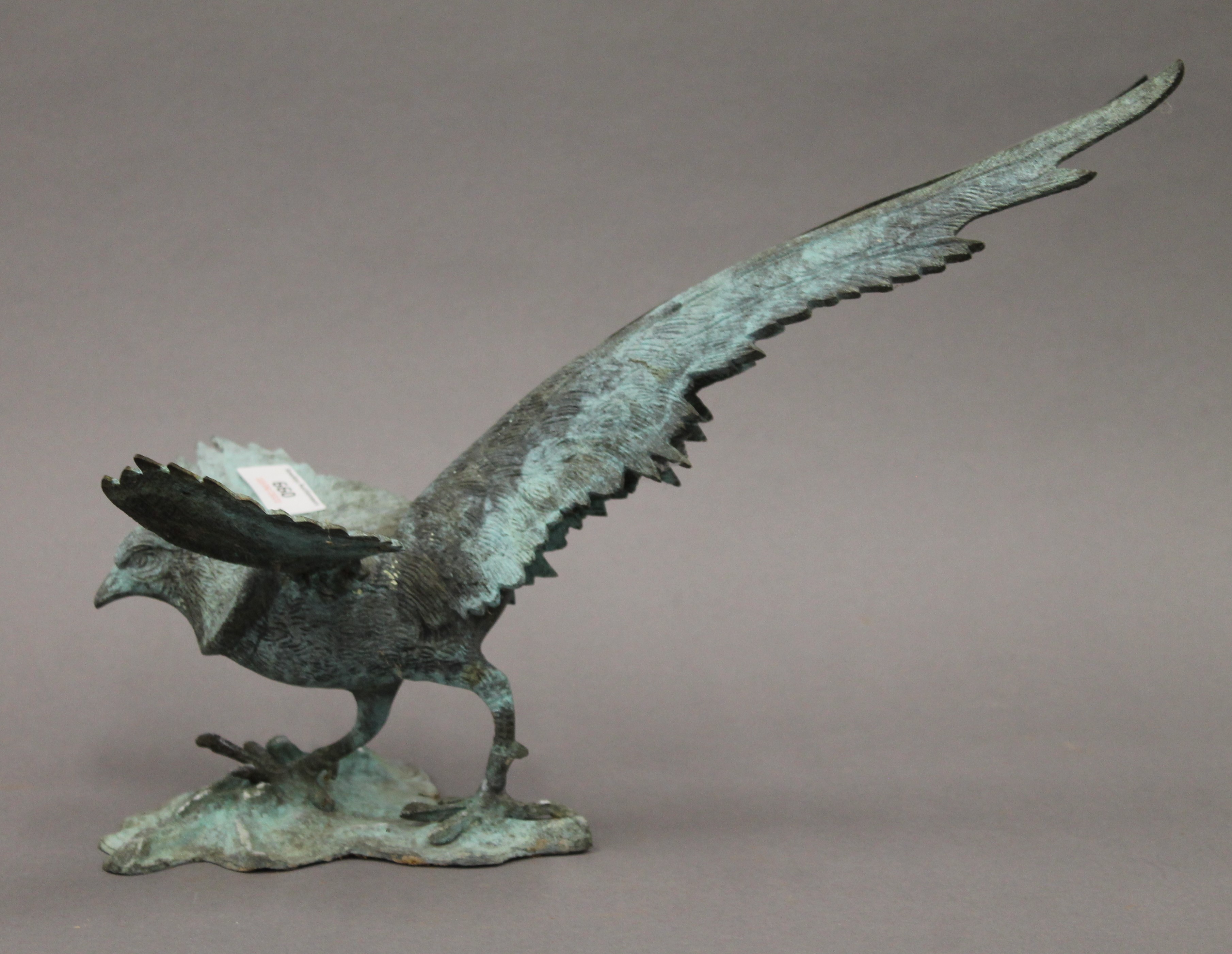 A patinated white metal model of a phoenix. 38 cm long. - Image 2 of 3