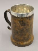 An early leather covered Scottish silver tankard. 18.5 cm high. 18 troy ounces total weight.