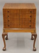 A mid- 20th century cutlery canteen cabinet, with key. 60.5 cm wide.