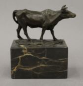 A small bronze model of a cow. 15 cm high.