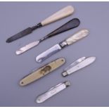 A quantity of silver, mother-of-pearl pen knives, etc.