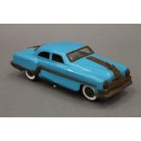 A 1950s tin plate Pontiac Rock and Roller friction car. 25 cm long.