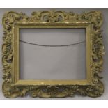 A Venetian carved wooden frame. external size 68.5 x 58.5 cm, inner size 46 x 36 cm.