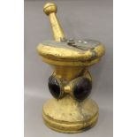 A 19th century gilt copper apothecary sign formed as a pestle and mortar. 81 cm high.