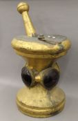 A 19th century gilt copper apothecary sign formed as a pestle and mortar. 81 cm high.