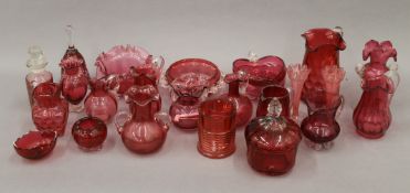 A collection of various cranberry glass.