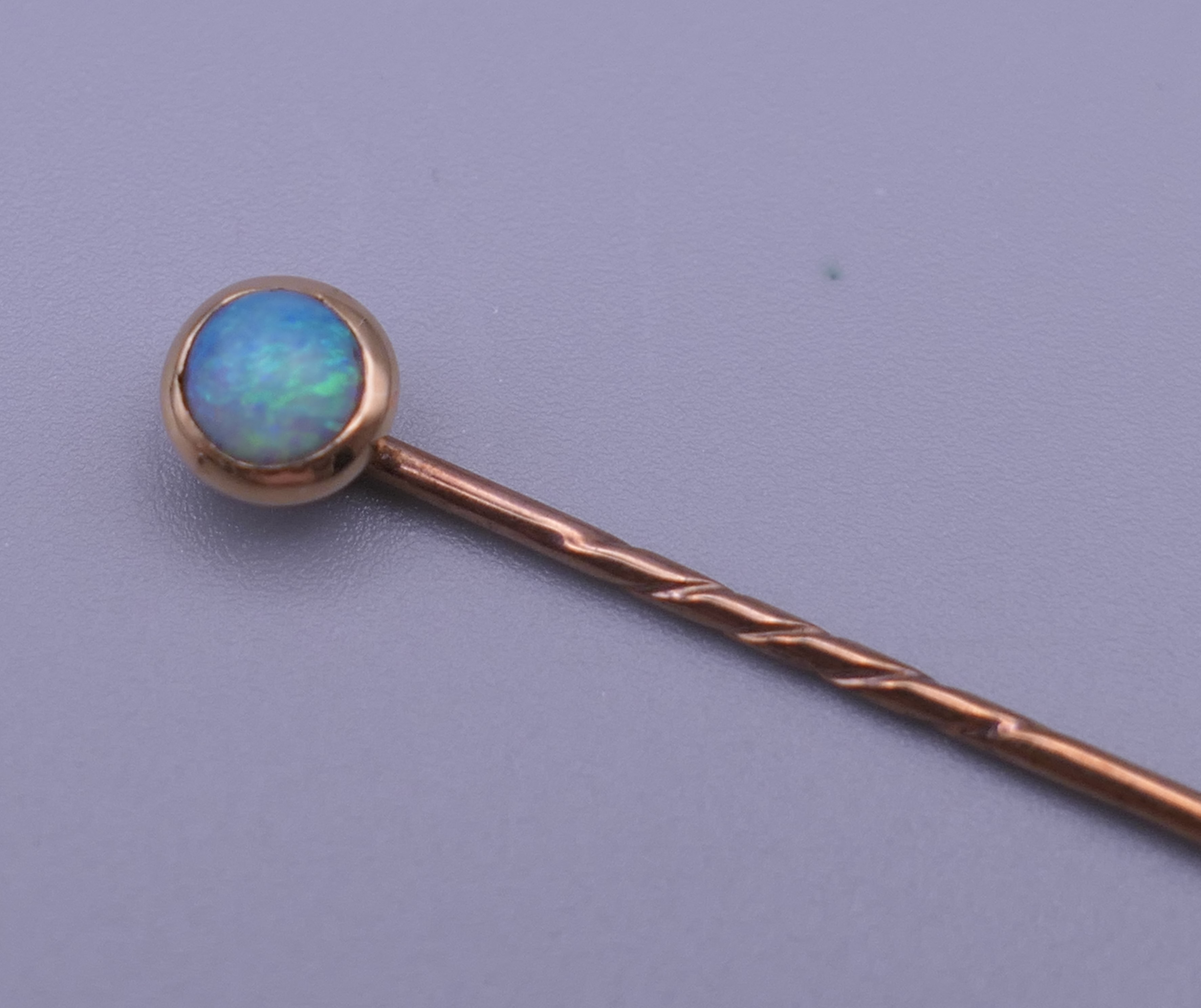 An opal mounted unmarked stickpin, housed in a leather box. 5.5 cm long. - Image 2 of 9