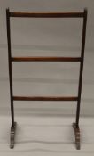 A Victorian mahogany towel rail. 52 cm wide.