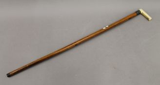 A Victorian ivory handled walking stick,