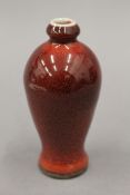 A small Chinese sang de boeuf vase. 13 cm high.