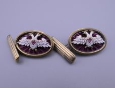 A pair of silver and enamel cufflinks, bearing Russian marks. Each 2.5 cm wide.