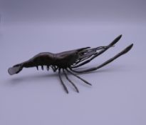 A bronze model of a shrimp. 14 cm long.