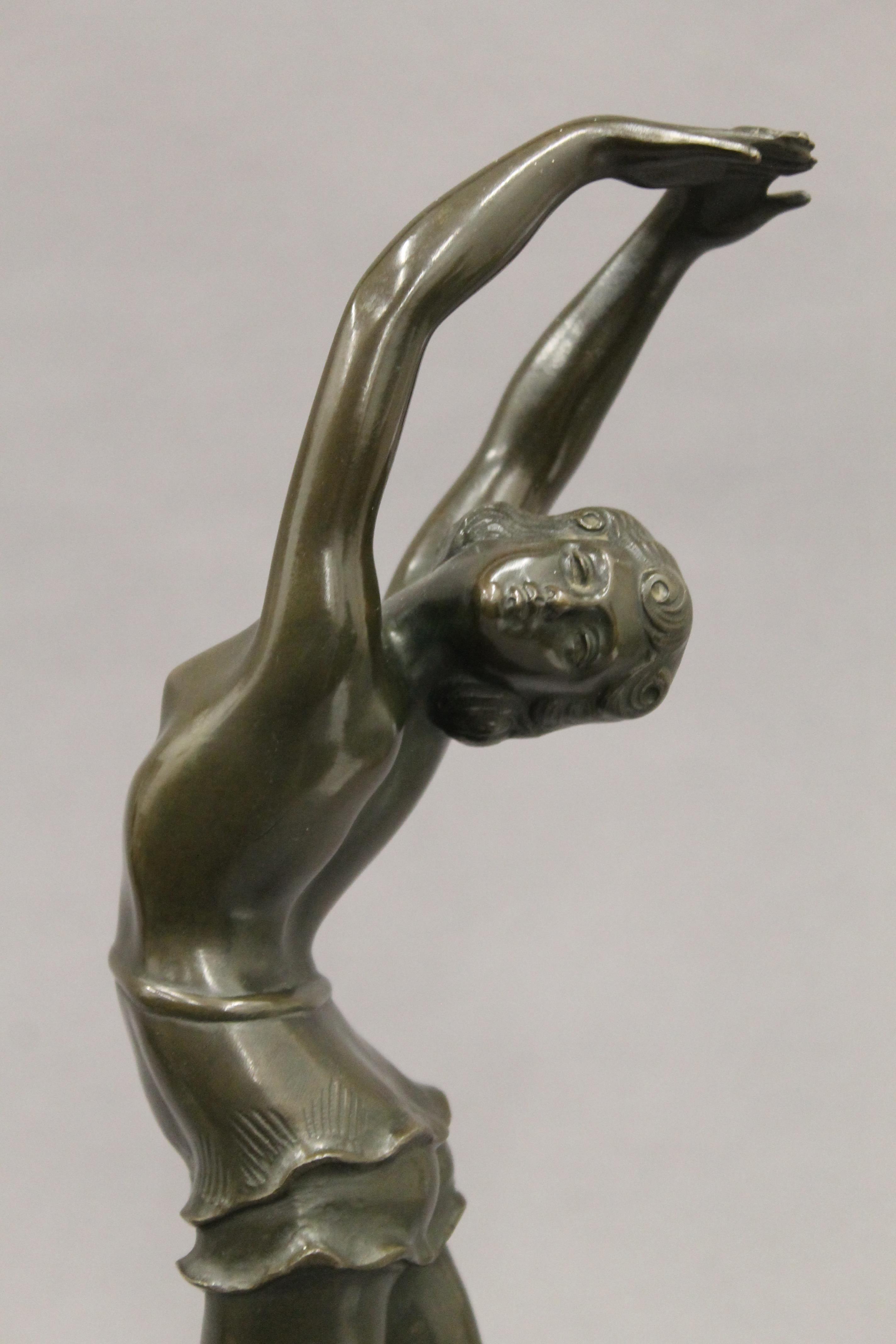 A patinated bronze model of an Art Deco dancing lady, signed S MELANI, - Image 4 of 5