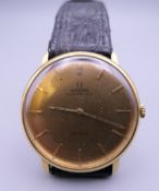 A gentleman's 18 ct gold cased Omega De Ville Automatic wristwatch. 3.5 cm wide.