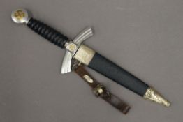 A German dagger with associated scabbard. 35.5 cm long.