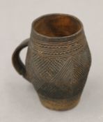 A Luba tribal carved wooden cup. 8 cm high.