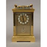 A brass cased repeating carriage clock. 19 cm high.