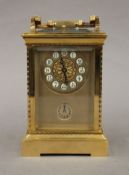 A brass cased repeating carriage clock. 19 cm high.