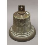 A bronze bell, inscribed ''GRVI''. 25 cm high.