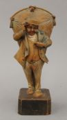 A late 19th/early 20th century carved wooden figure, inscribed ''Mr Dick and His Kite''. 23.