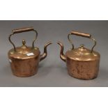 Two Victorian copper kettles. Each approximately 26 cm high.