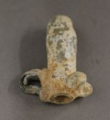 A small antiquity glass vessel. 4.75 cm long.