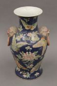 A Chinese blue and white vase decorated with peonies and butterflies. 35 cm high.