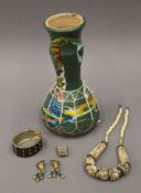 An ethnic drum and jewellery. The former 26 cm high.