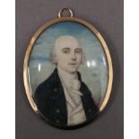 A Georgian miniature portrait on ivory depicting a young gentleman, set in an unmarked gold frame,