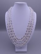 A rock crystal faceted and graduated bead two row necklace with a silver clasp. 50 cm long.