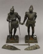 A pair of 19th century Austrian bronze models of knights. The largest 35.5 cm high.