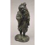 A Japanese Meiji period bronze model of a man with a monkey. 32 cm high.