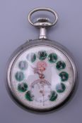 A Continental silver plated pocket watch with enamel decorated dial. 6.5 cm wide.