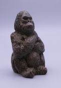 A bronze model of a gorilla. 5 cm high.