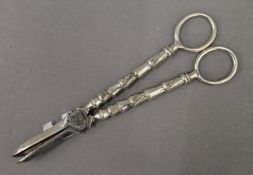 A pair of silver plated grape scissors. 17 cm long.