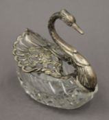 A silver and cut glass swan. 12 cm high.
